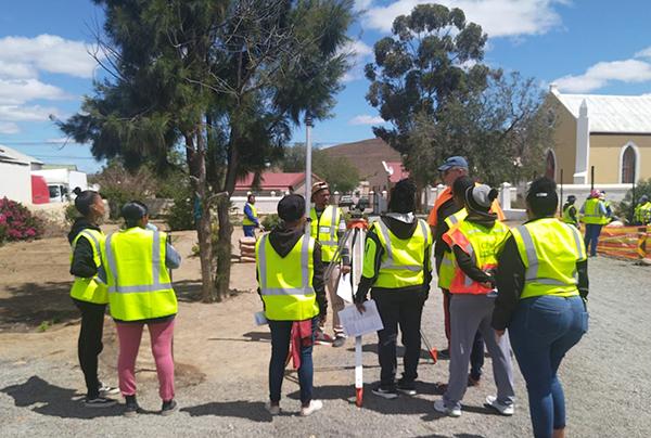 Surveying team gathered at an outdoor site